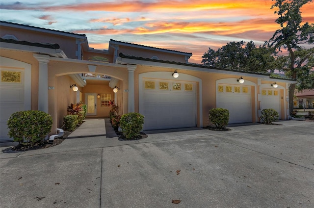 206 Gondola Park Dr Unit 206, Venice, FL 34292 - view of front facade featuring concrete driveway, stucco siding, and a garage