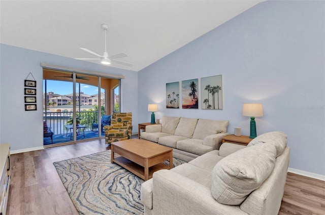 206 Gondola Park Dr Unit 206, Venice, FL 34292 - living room featuring lofted ceiling, wood finished floors, ceiling fan, and baseboards