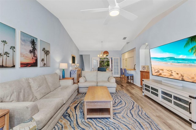 206 Gondola Park Dr Unit 206, Venice, FL 34292 - living room featuring a chandelier, vaulted ceiling, light wood-style floors, and ceiling fan
