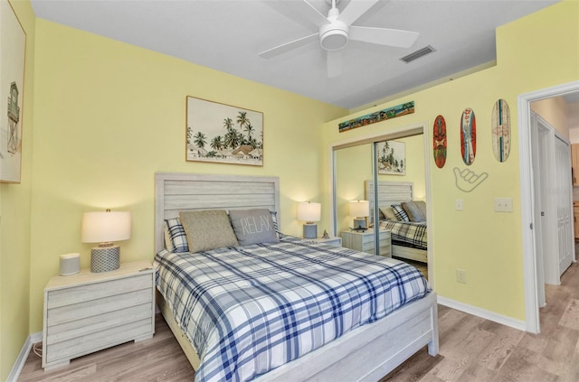 206 Gondola Park Dr Unit 206, Venice, FL 34292 - bedroom with wood finished floors, baseboards, a closet, and a ceiling fan