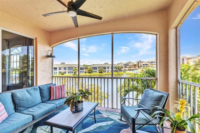 206 Gondola Park Dr Unit 206, Venice, FL 34292 - sunroom / solarium with a water view, a ceiling fan, an outdoor living space, and a residential view