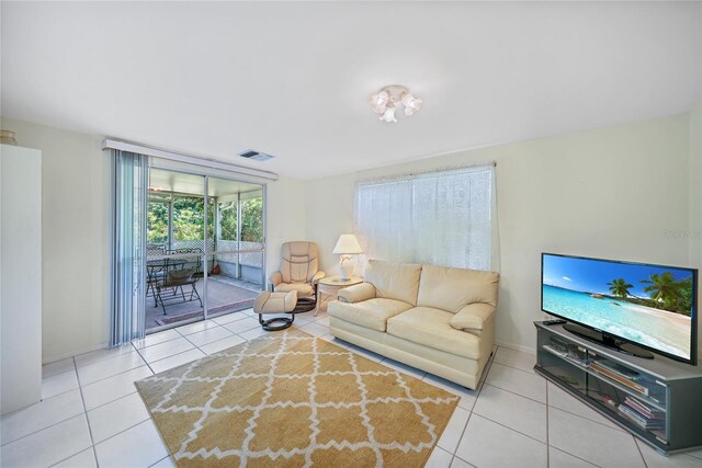 1596 Hayworth Rd, Port Charlotte, FL 33952 - living room with tile patterned flooring and baseboards