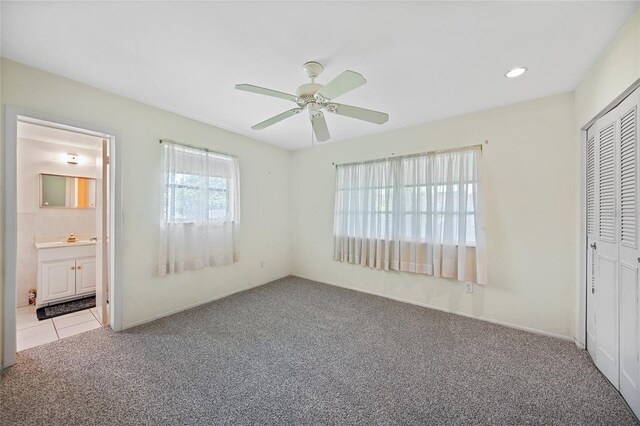 1596 Hayworth Rd, Port Charlotte, FL 33952 - unfurnished bedroom featuring carpet, a closet, ceiling fan, ensuite bath, and recessed lighting