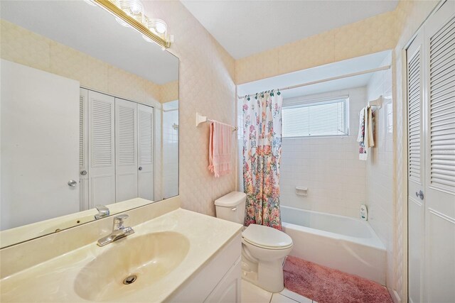 1596 Hayworth Rd, Port Charlotte, FL 33952 - full bathroom featuring a closet, toilet, vanity, shower / tub combo, and wallpapered walls