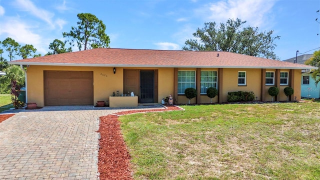 2626 Auburn Blvd, Port Charlotte, FL 33948 - ranch-style house featuring a garage, stucco siding, decorative driveway, and a front lawn