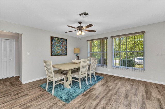 2626 Auburn Blvd, Port Charlotte, FL 33948 - dining room with wood finished floors, baseboards, and ceiling fan