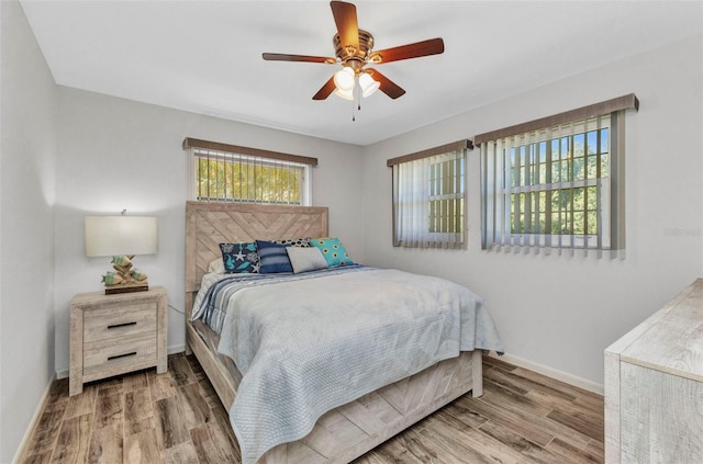 2626 Auburn Blvd, Port Charlotte, FL 33948 - bedroom featuring wood finished floors, baseboards, and a ceiling fan