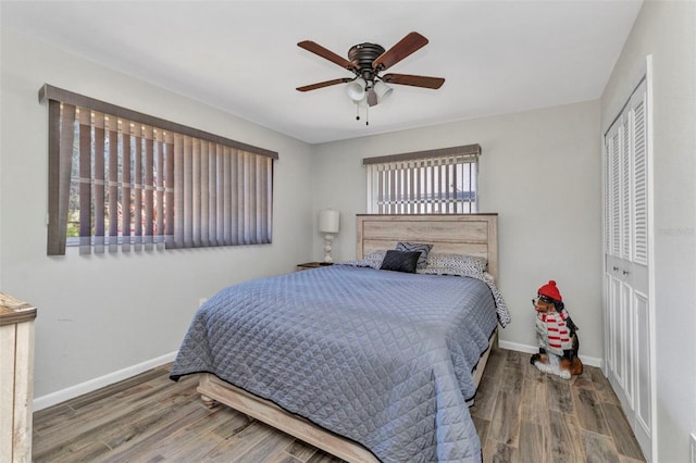2626 Auburn Blvd, Port Charlotte, FL 33948 - bedroom with wood finished floors, multiple windows, a closet, and baseboards