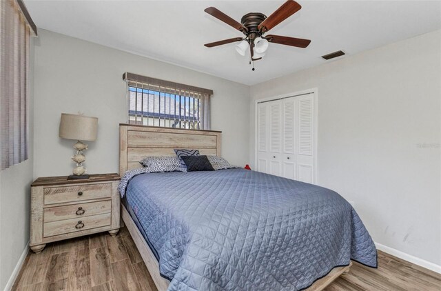 2626 Auburn Blvd, Port Charlotte, FL 33948 - bedroom with baseboards, wood finished floors, a closet, and ceiling fan