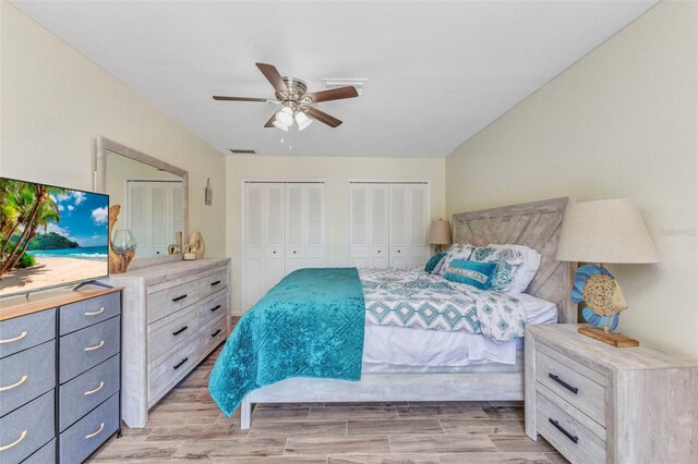 2626 Auburn Blvd, Port Charlotte, FL 33948 - bedroom featuring multiple closets, light wood-type flooring, and ceiling fan