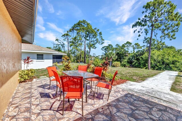2626 Auburn Blvd, Port Charlotte, FL 33948 - view of patio / terrace with outdoor dining area