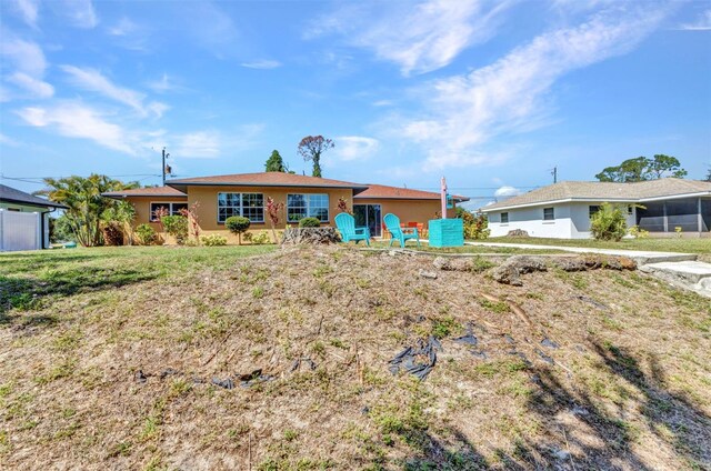 2626 Auburn Blvd, Port Charlotte, FL 33948 - view of front of property with stucco siding and a front yard