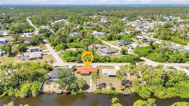 2626 Auburn Blvd, Port Charlotte, FL 33948 - aerial view of residential area with a large body of water and a heavily wooded area