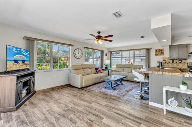 2626 Auburn Blvd, Port Charlotte, FL 33948 - living room with light wood-style floors and ceiling fan