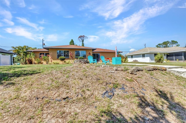 2626 Auburn Blvd, Port Charlotte, FL 33948 - view of front of home with stucco siding and a front yard
