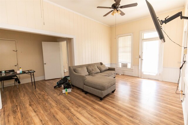 114 N Dade Ave, Arcadia, FL 34266 - living room with a ceiling fan, light wood-type flooring, crown molding, and cooling unit