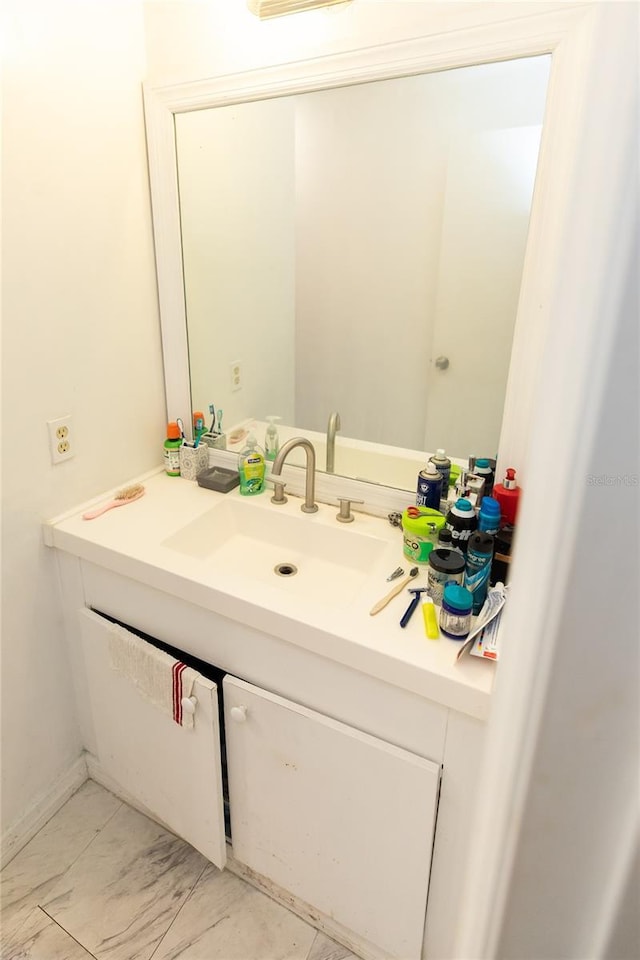 114 N Dade Ave, Arcadia, FL 34266 - bathroom with vanity and marble look tile flooring