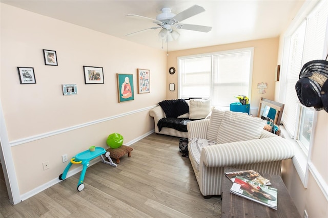 114 N Dade Ave, Arcadia, FL 34266 - living area with a ceiling fan, wood finished floors, and baseboards