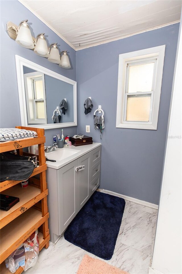 114 N Dade Ave, Arcadia, FL 34266 - bathroom with marble finish flooring, vanity, and crown molding