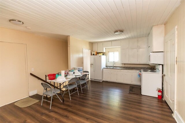 114 N Dade Ave, Arcadia, FL 34266 - kitchen featuring white appliances, dark countertops, wooden ceiling, a sink, and dark wood-type flooring