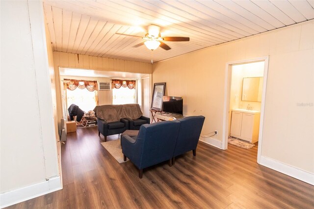 114 N Dade Ave, Arcadia, FL 34266 - living room featuring dark wood-style flooring, a ceiling fan, wood ceiling, an AC wall unit, and baseboards