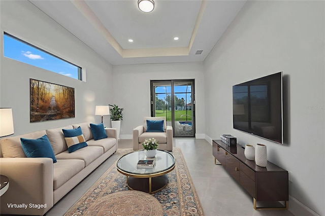 15 Tournament Rd, Rotonda West, FL 33947 - living room featuring recessed lighting, a tray ceiling, and concrete floors