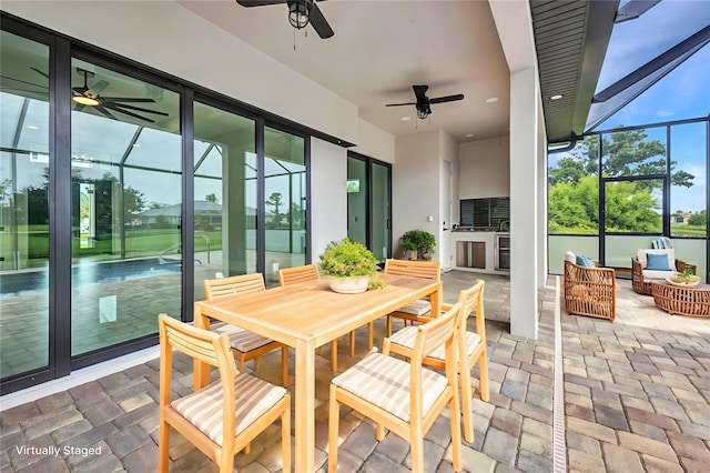 15 Tournament Rd, Rotonda West, FL 33947 - sunroom with a ceiling fan, outdoor lounge area, and outdoor dining area