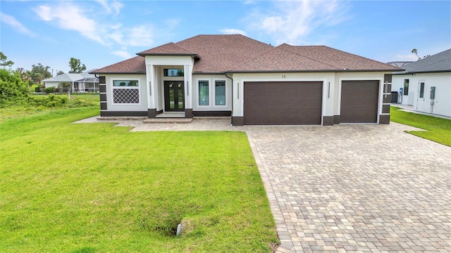 15 Tournament Rd, Rotonda West, FL 33947 - view of front facade featuring an attached garage, a front lawn, decorative driveway, and stucco siding