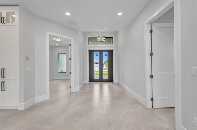 15 Tournament Rd, Rotonda West, FL 33947 - entrance foyer featuring french doors, recessed lighting, and light tile patterned flooring