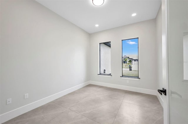 15 Tournament Rd, Rotonda West, FL 33947 - spare room with baseboards and recessed lighting