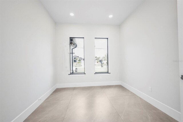15 Tournament Rd, Rotonda West, FL 33947 - empty room with recessed lighting and light tile patterned floors