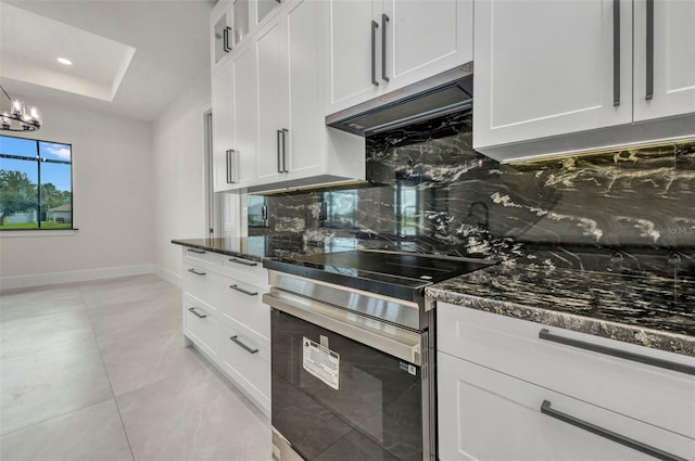 15 Tournament Rd, Rotonda West, FL 33947 - kitchen featuring stainless steel electric stove, backsplash, dark stone counters, white cabinets, and recessed lighting