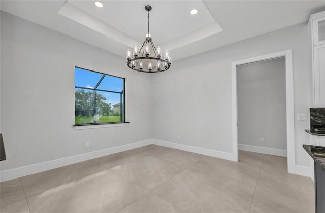 15 Tournament Rd, Rotonda West, FL 33947 - unfurnished dining area featuring a chandelier, recessed lighting, a raised ceiling, and light tile patterned floors