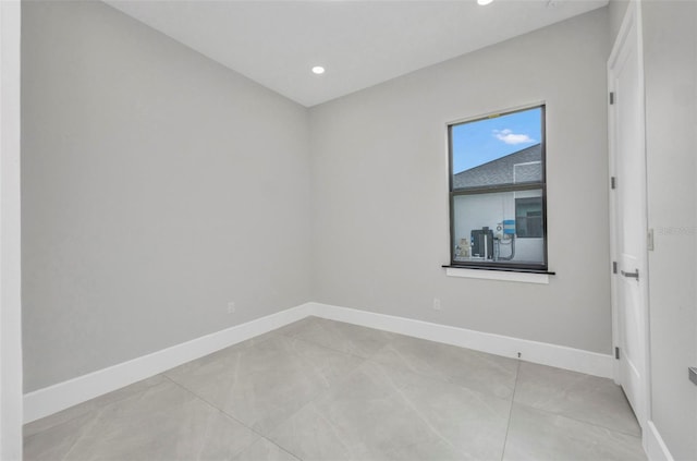 15 Tournament Rd, Rotonda West, FL 33947 - spare room featuring recessed lighting and light tile patterned floors