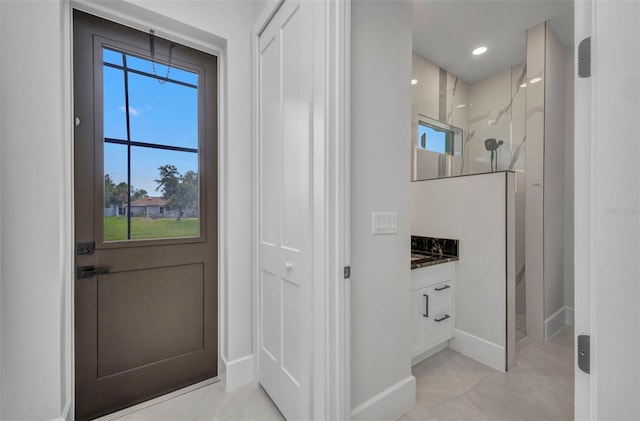 15 Tournament Rd, Rotonda West, FL 33947 - doorway featuring baseboards and light tile patterned floors