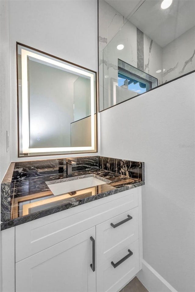 15 Tournament Rd, Rotonda West, FL 33947 - bathroom with vanity and a shower