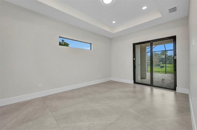 15 Tournament Rd, Rotonda West, FL 33947 - empty room featuring recessed lighting, finished concrete flooring, and a raised ceiling