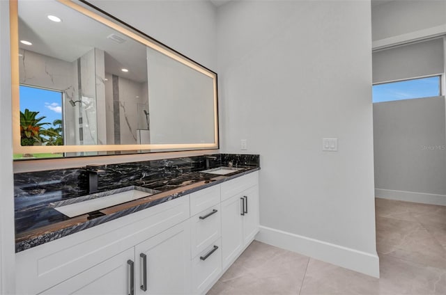 15 Tournament Rd, Rotonda West, FL 33947 - full bathroom featuring double vanity, a marble finish shower, and recessed lighting