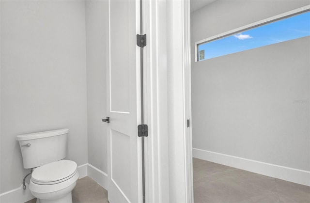 15 Tournament Rd, Rotonda West, FL 33947 - bathroom featuring baseboards and toilet