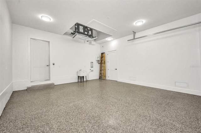 15 Tournament Rd, Rotonda West, FL 33947 - garage featuring baseboards