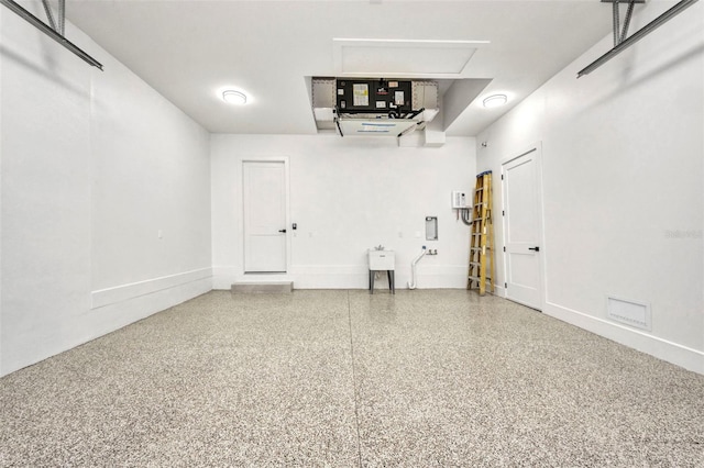 15 Tournament Rd, Rotonda West, FL 33947 - garage featuring baseboards