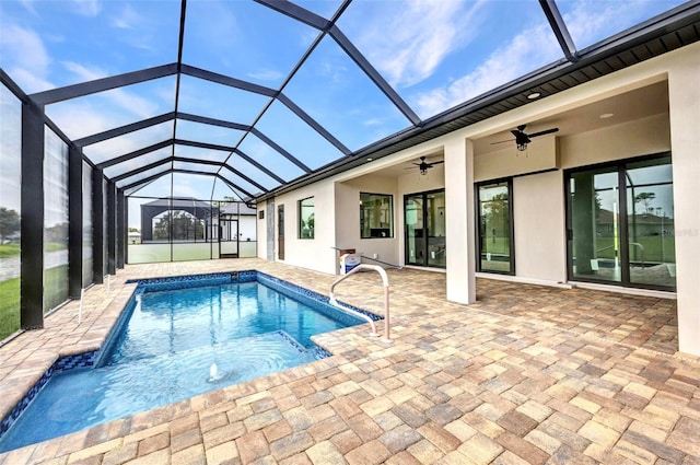 15 Tournament Rd, Rotonda West, FL 33947 - swimming pool with a ceiling fan, a patio area, and glass enclosure
