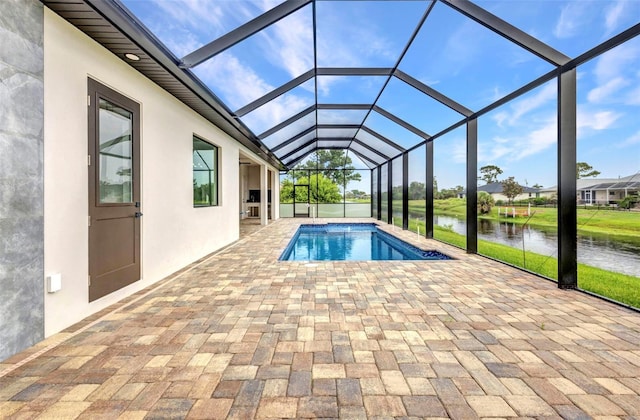 15 Tournament Rd, Rotonda West, FL 33947 - outdoor pool featuring a water view, a patio area, and a lanai