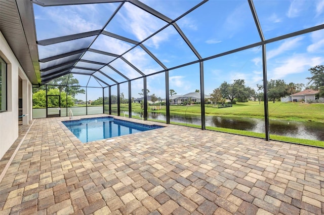 15 Tournament Rd, Rotonda West, FL 33947 - swimming pool featuring a patio area, a water view, a lanai, and a lawn