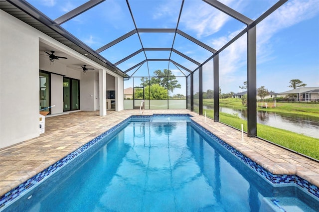 15 Tournament Rd, Rotonda West, FL 33947 - swimming pool with a water view, a ceiling fan, a patio area, and a lanai