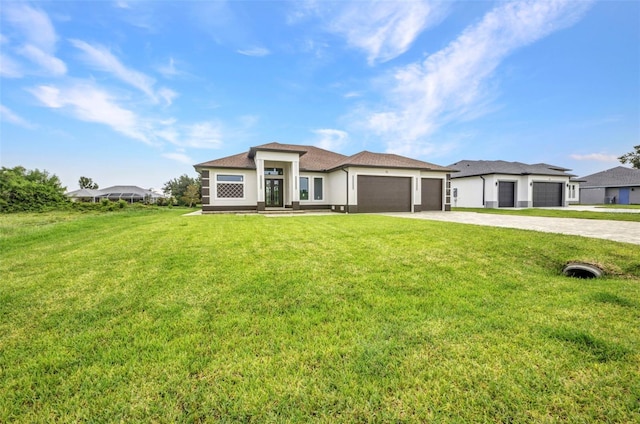 15 Tournament Rd, Rotonda West, FL 33947 - prairie-style home featuring driveway, an attached garage, a front yard, and stucco siding