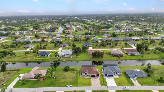 15 Tournament Rd, Rotonda West, FL 33947 - aerial overview of property's location featuring a large body of water and nearby suburban area