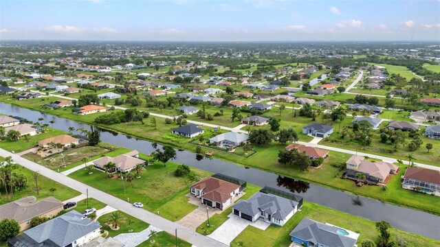 15 Tournament Rd, Rotonda West, FL 33947 - aerial view of property's location with a large body of water and nearby suburban area