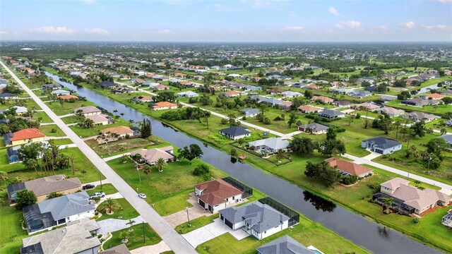 15 Tournament Rd, Rotonda West, FL 33947 - aerial view of property and surrounding area with a nearby body of water and nearby suburban area