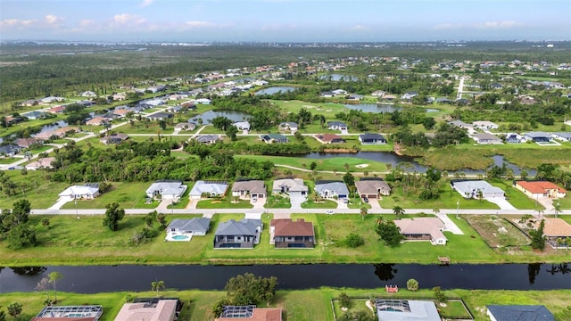 15 Tournament Rd, Rotonda West, FL 33947 - aerial view of property and surrounding area featuring nearby suburban area and a large body of water